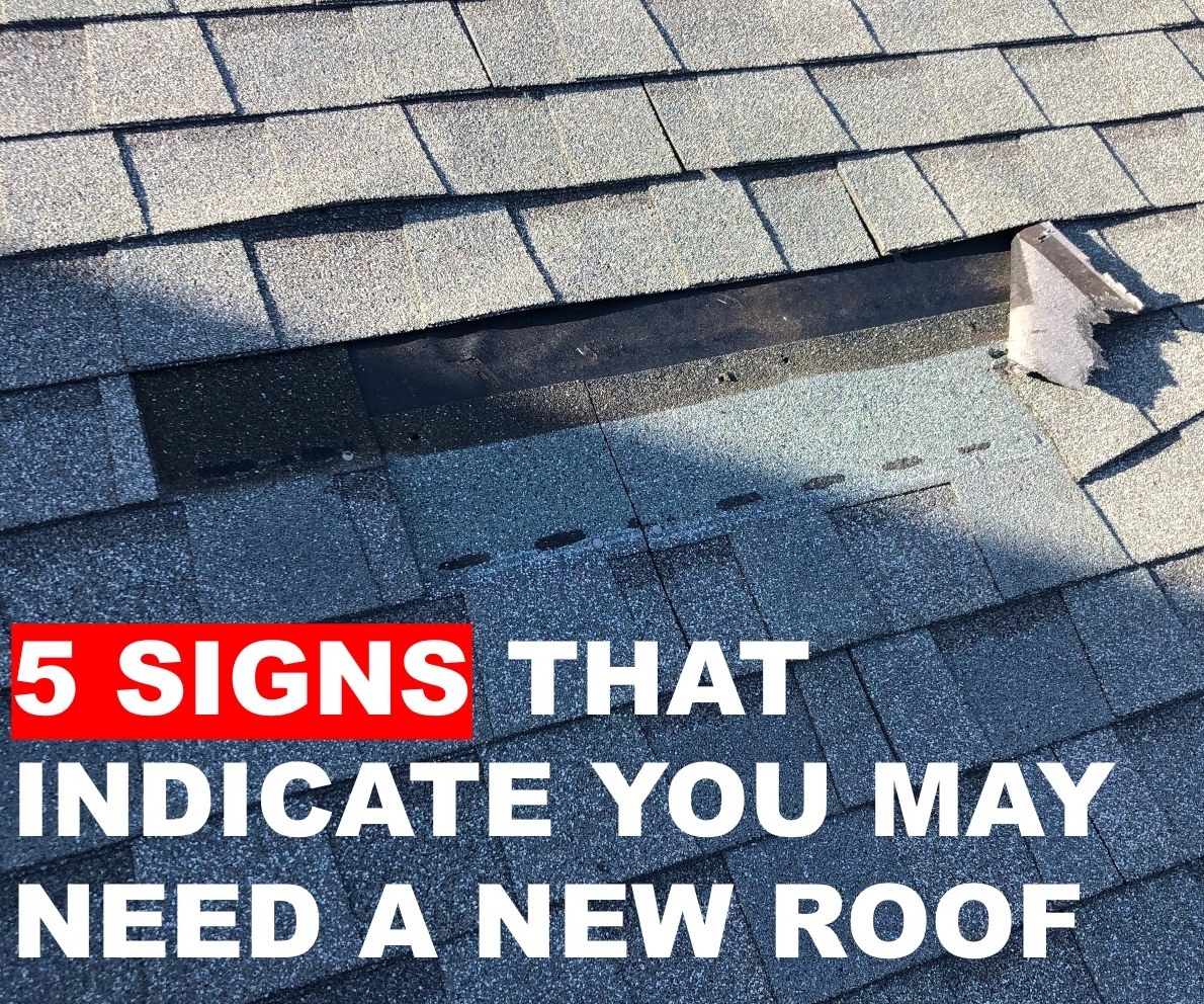 Damaged and lifting shingles on a worn roof