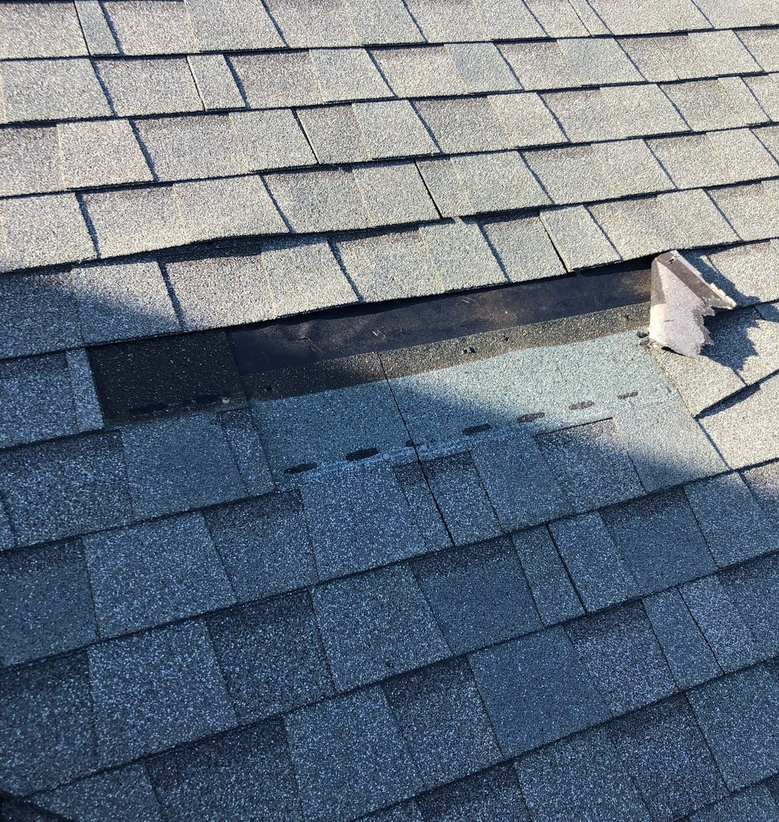Fresh asphalt shingles on a new roof
