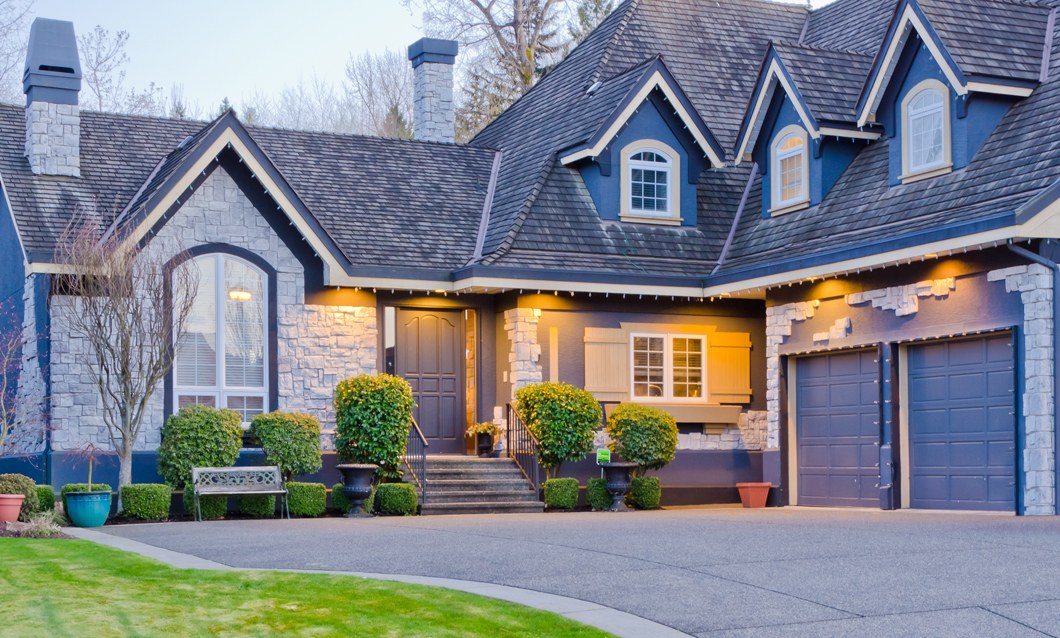 Home with a finished roof and siding at dusk